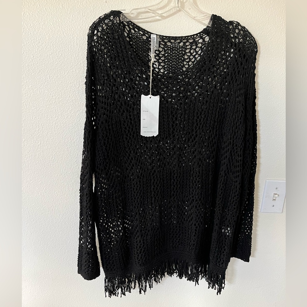 Black knit top by Mollo Rollo. New never been worn.  XL